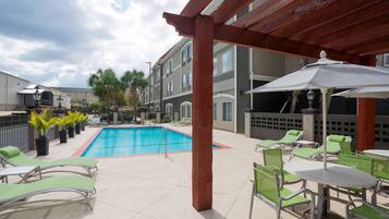 Outdoor pool, open 7:00 AM to 10:00 PM, pool umbrellas, pool loungers