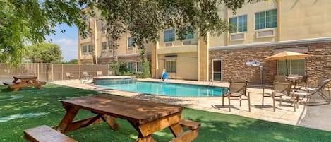 Seasonal outdoor pool, open 9:00 AM to 10:00 PM, sun loungers