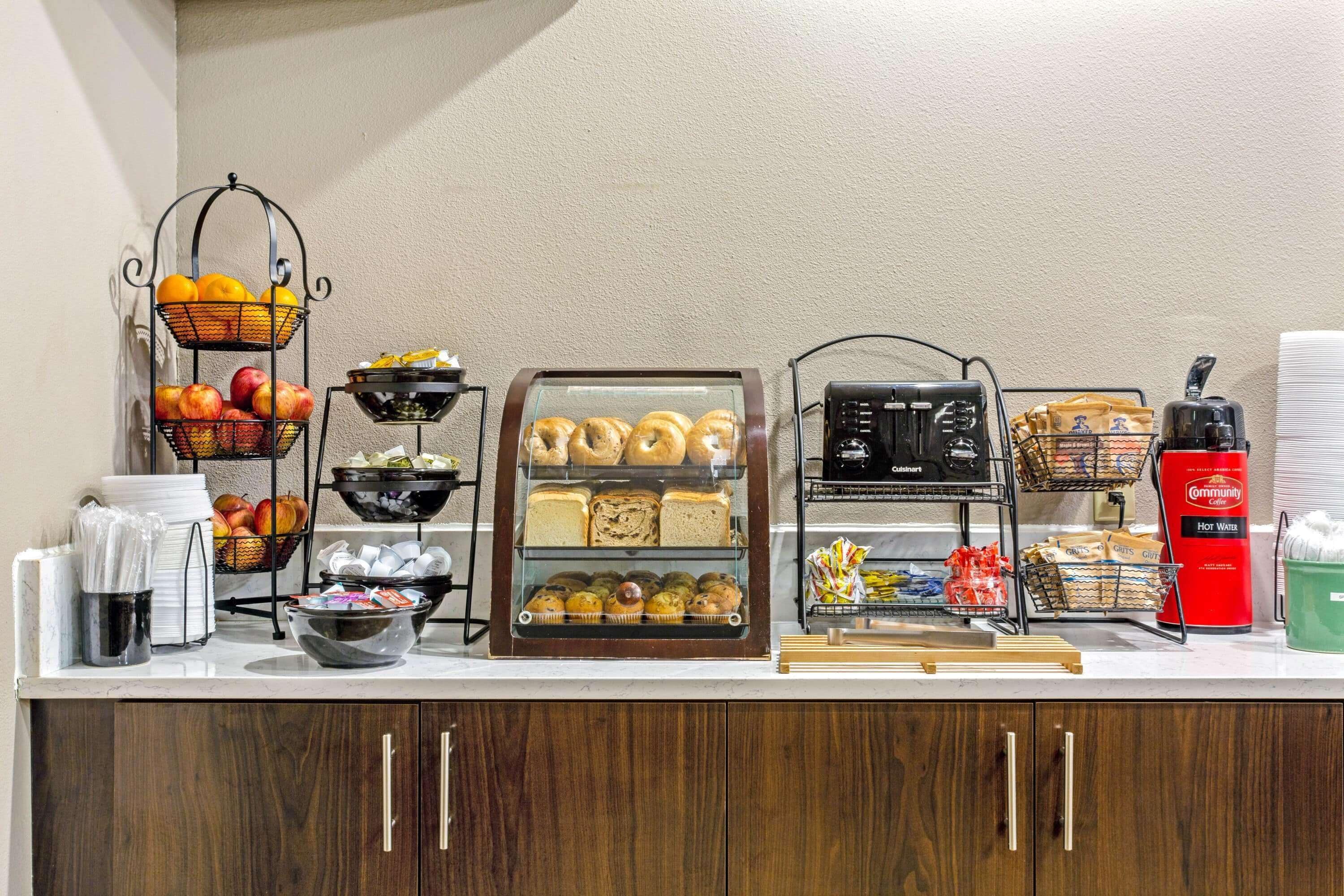 A breakfast buffet with various food items and beverages.