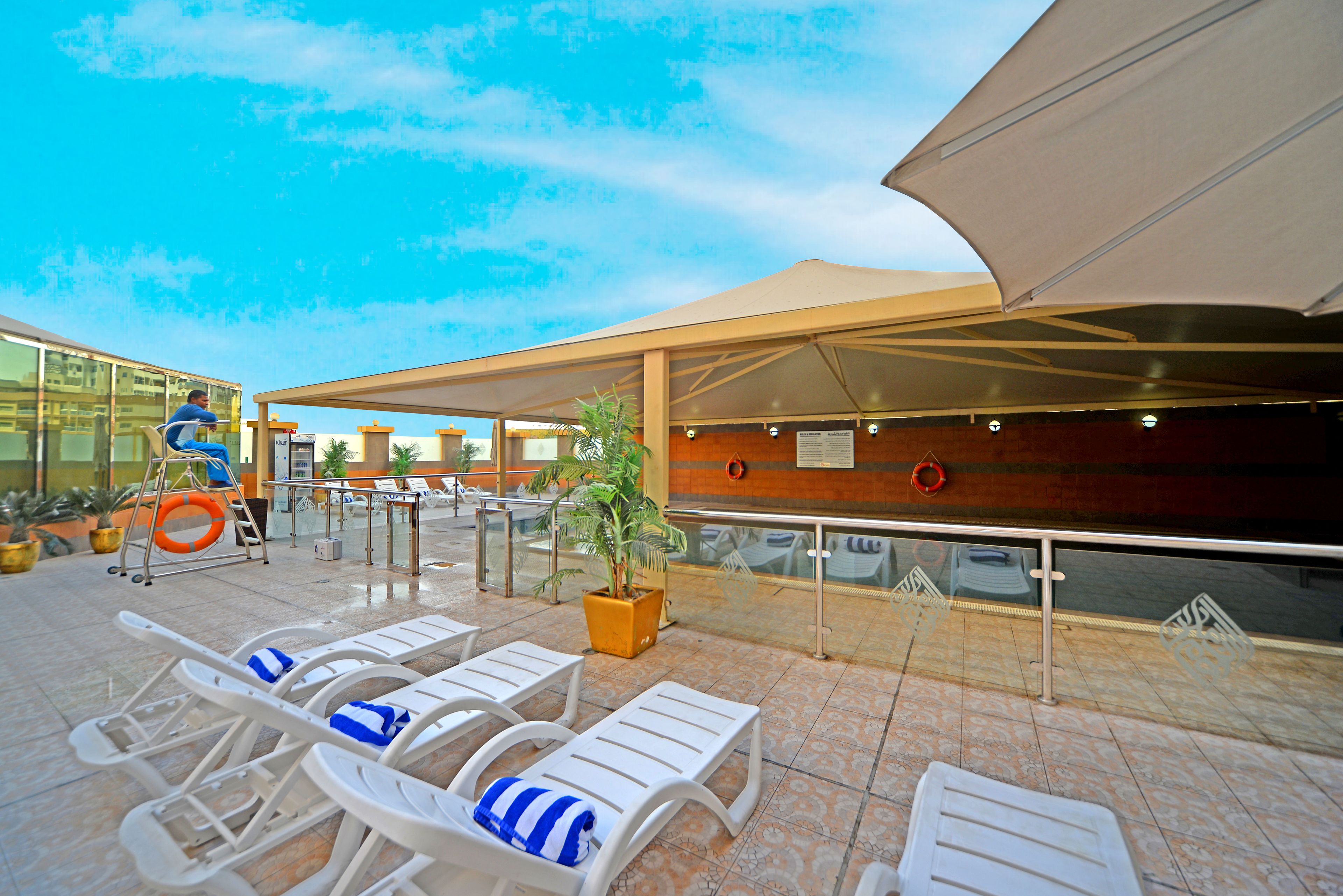 Outdoor pool, pool umbrellas, sun loungers