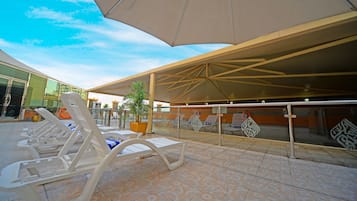 Outdoor pool, pool umbrellas, pool loungers