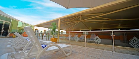 Outdoor pool, pool umbrellas, pool loungers