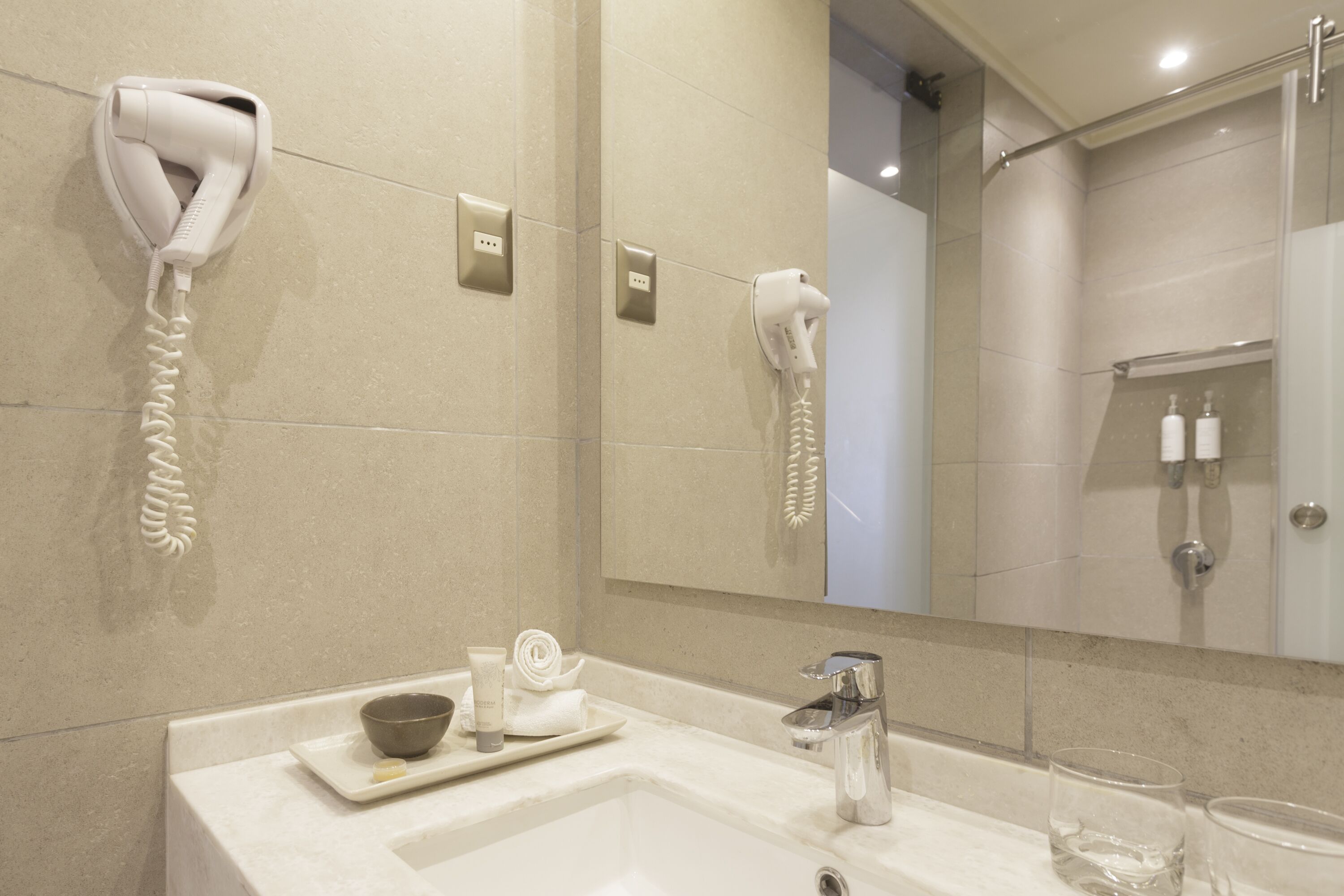 rainfall showerhead, eco-friendly toiletries, hair dryer, towels