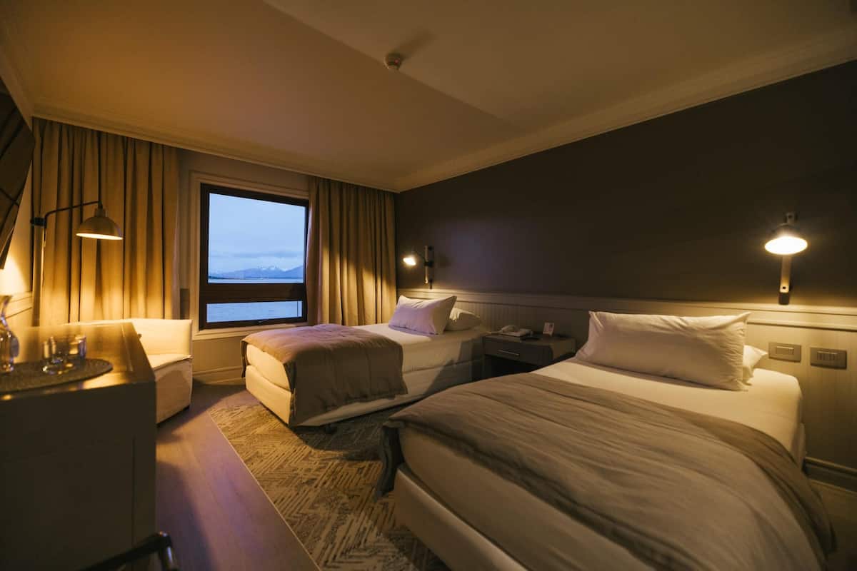 Premium bedding, down comforters, in-room safe, laptop workspace