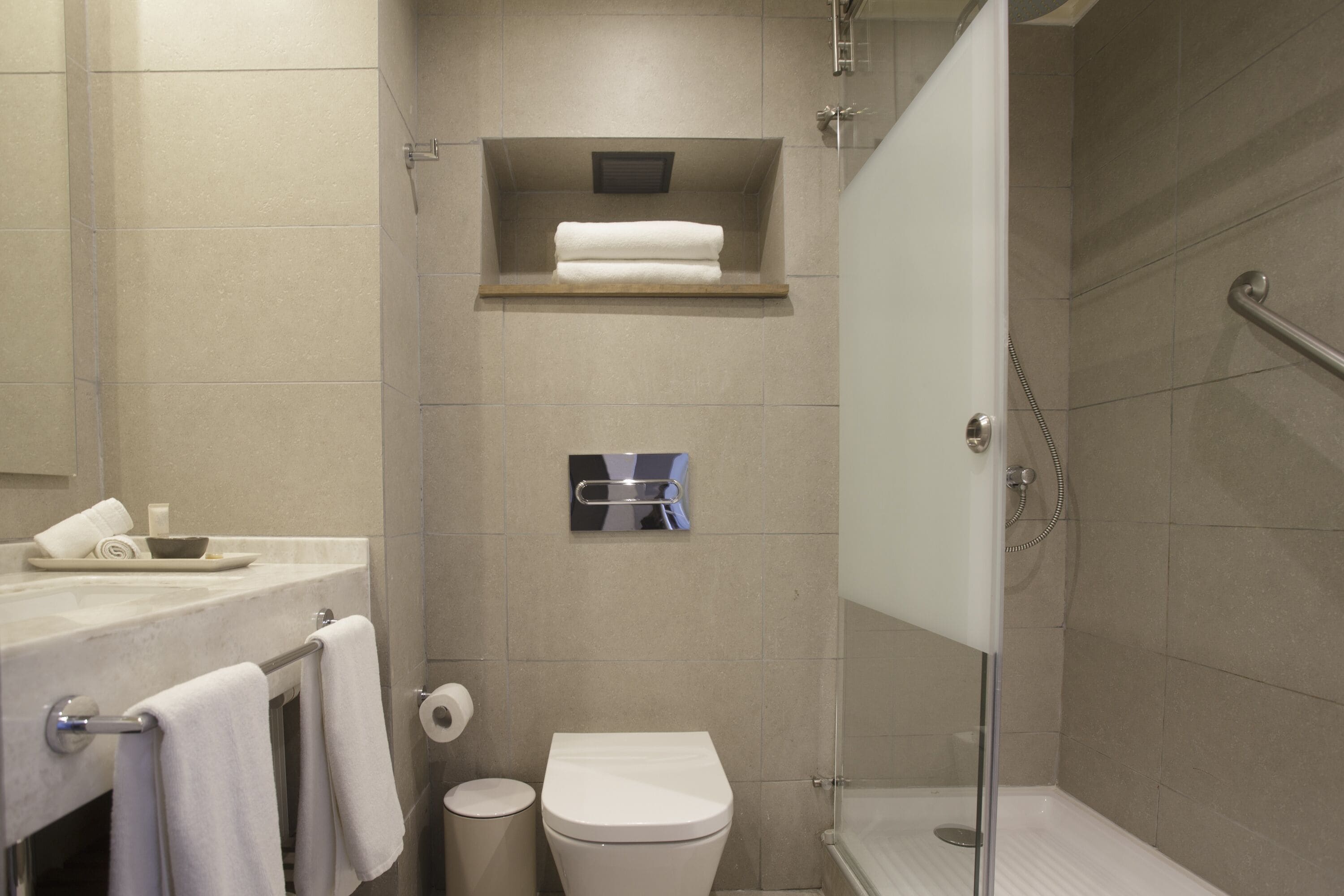 rainfall showerhead, eco-friendly toiletries, hair dryer, towels