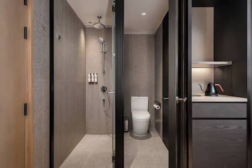 Shower, hair dryer, slippers, towels