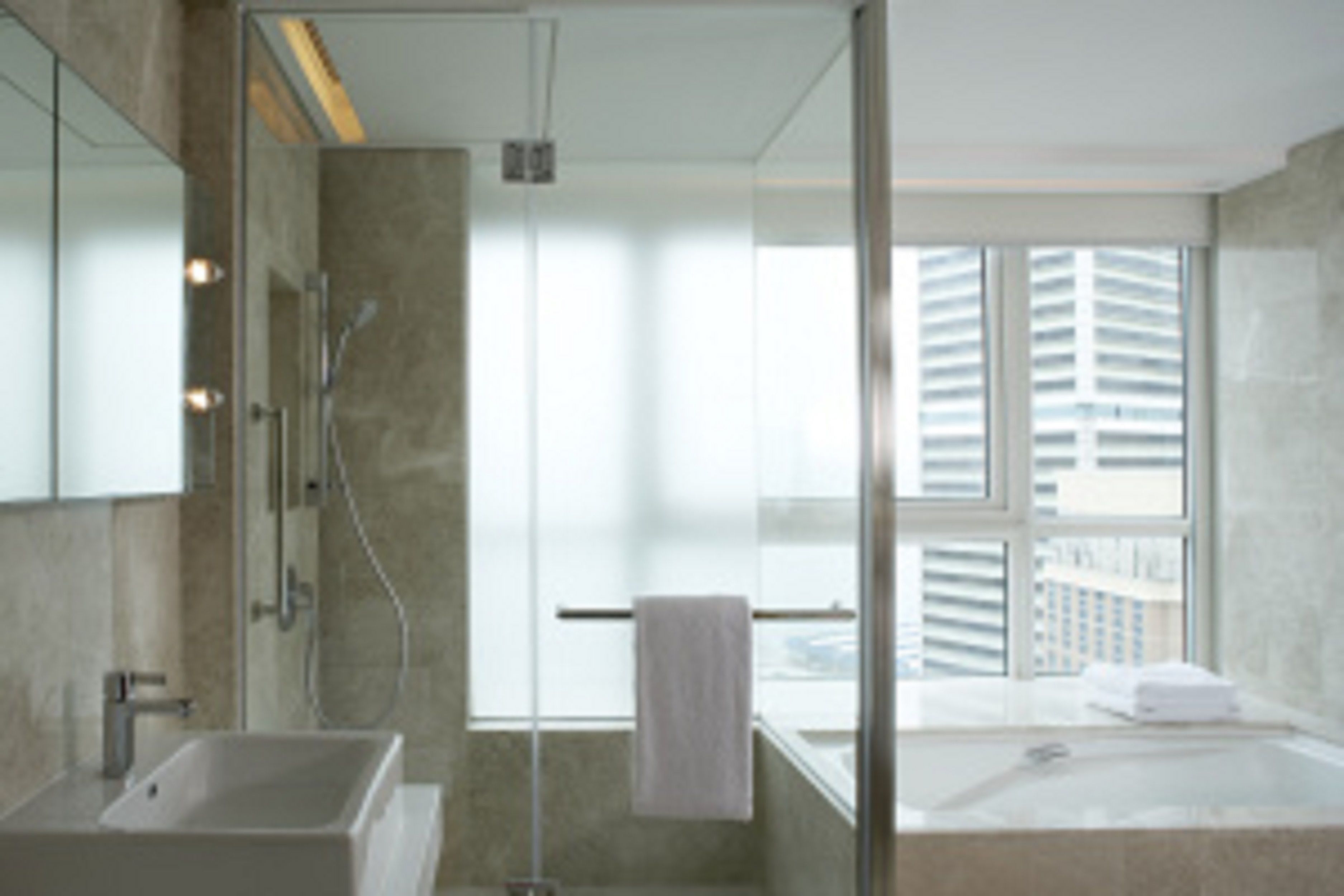 shower, hair dryer, slippers, towels