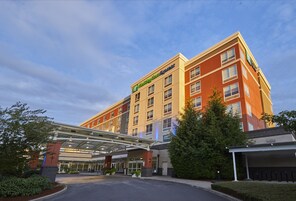 A Holiday Inn Express hotel with a covered entrance and multiple floors.