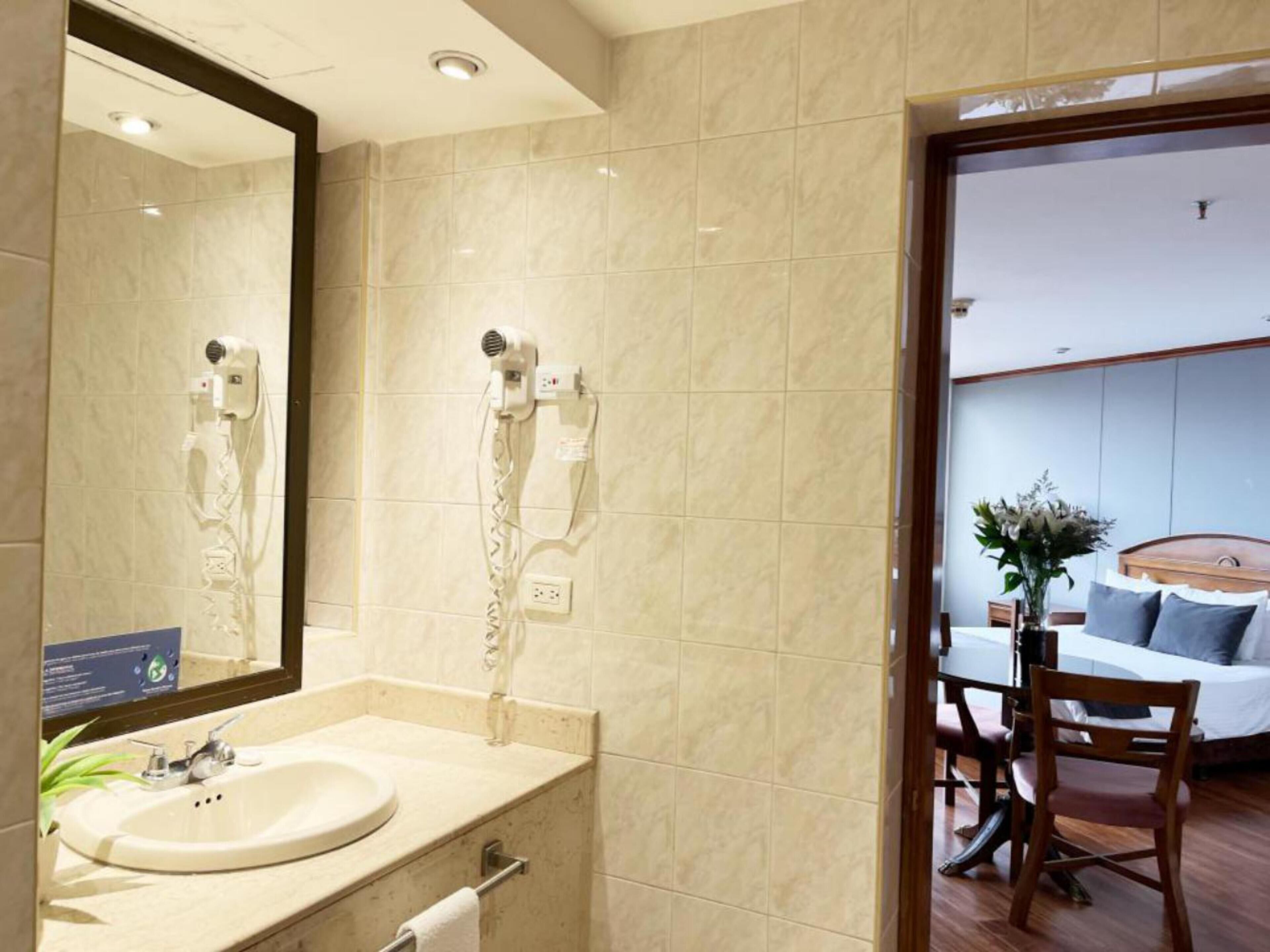 standard double room | bathroom | rainfall showerhead, hair dryer, towels, soap