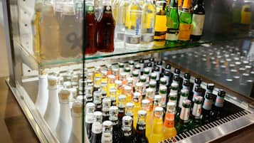 A refrigerated display case with various bottled beverages.