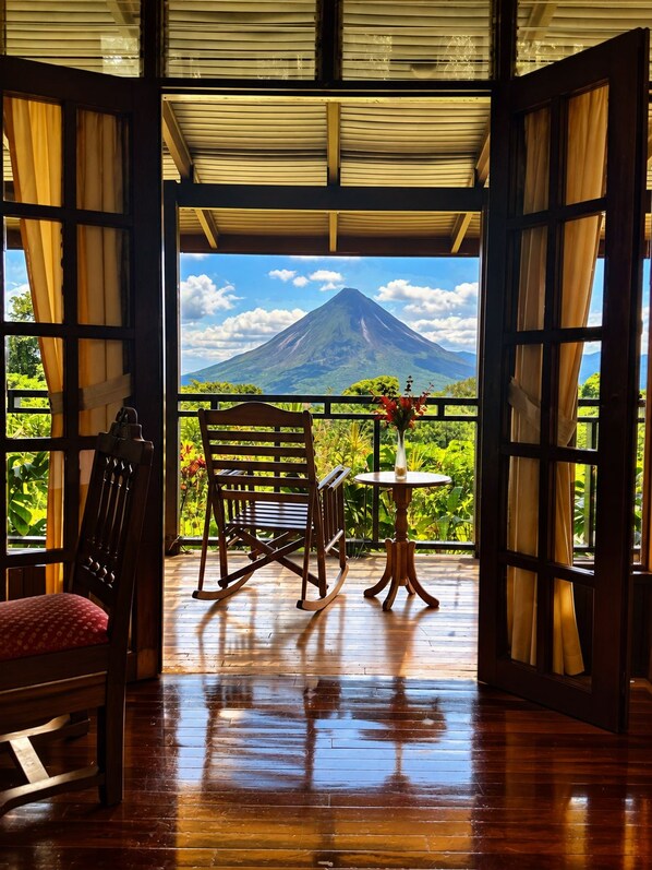 A wooden interior with a view of a mountain.