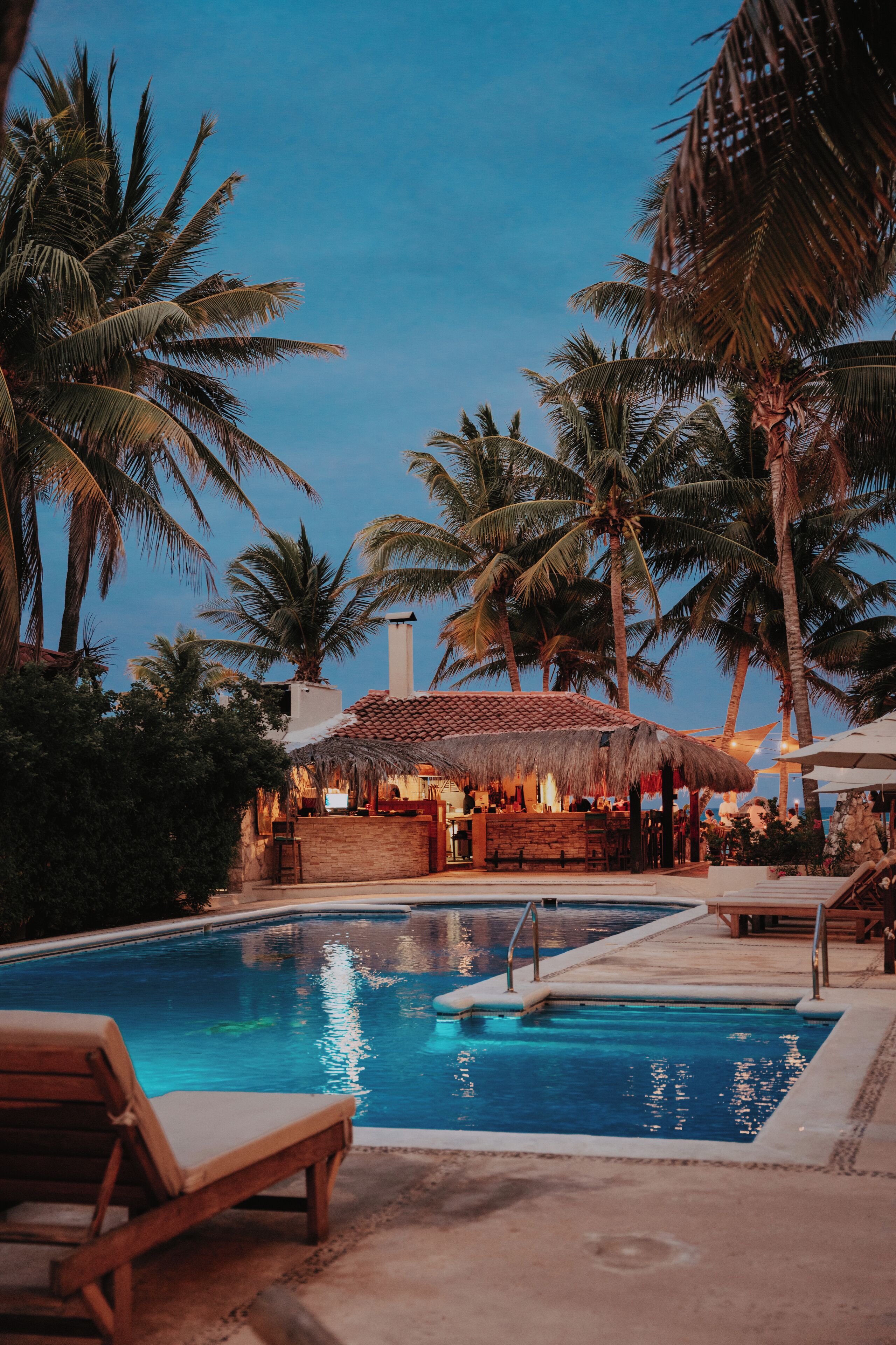 outdoor pool, open 8:00 am to 7:30 pm, pool umbrellas