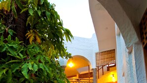 A staircase with a tiled floor leading to a second level. - Hotel Silberstein (Puerto Ayora)