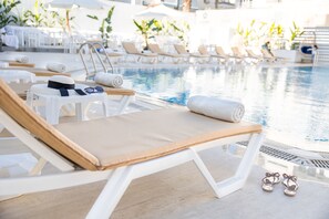 Seasonal outdoor pool, open 9:00 AM to 6:00 PM, free pool cabanas