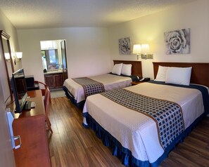 Hypo-allergenic bedding, desk, laptop workspace, blackout curtains