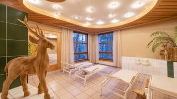 Enjoy a peaceful retreat with a unique ceiling design, large window offering a natural view, and a deer sculpture.