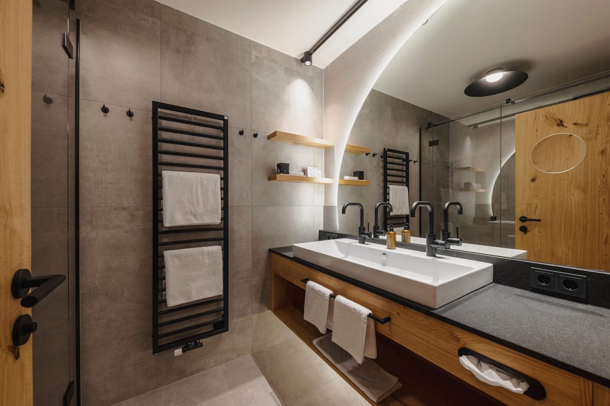 deluxe double room | bathroom | eco-friendly toiletries, hair dryer, bathrobes, slippers