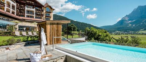 Indoor pool, outdoor pool, pool umbrellas
