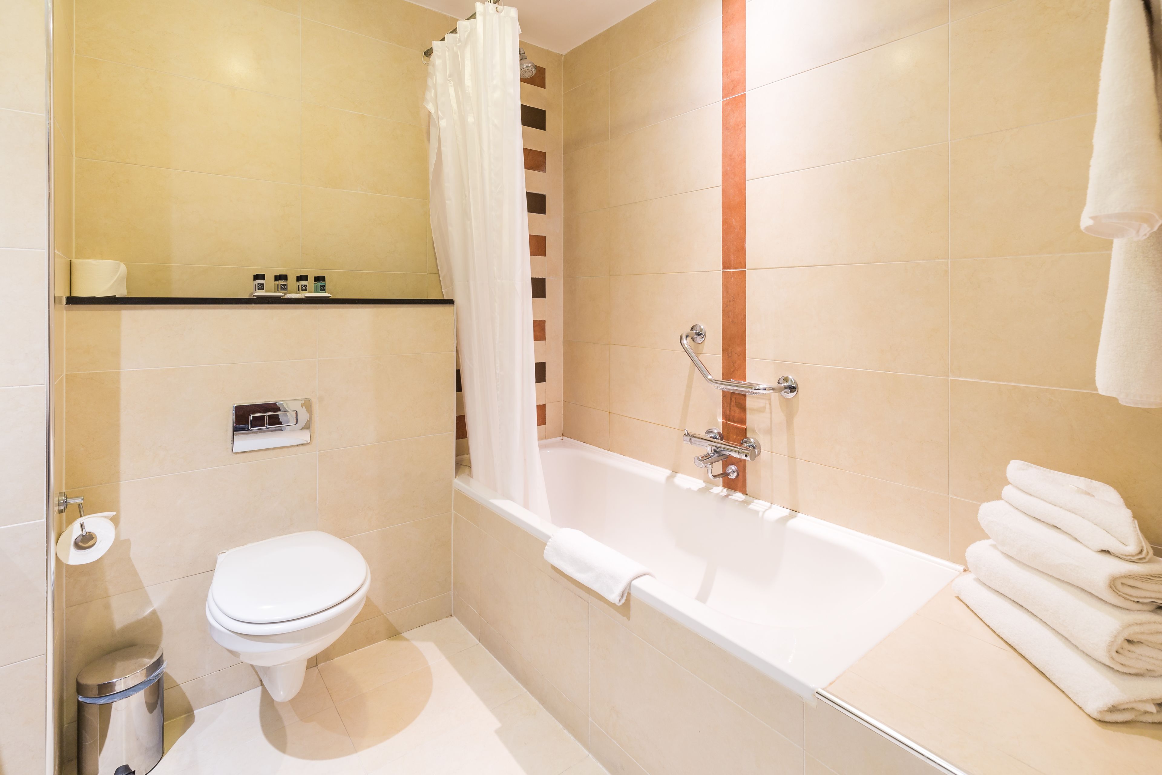 separate bathtub and shower, free toiletries, hair dryer, towels