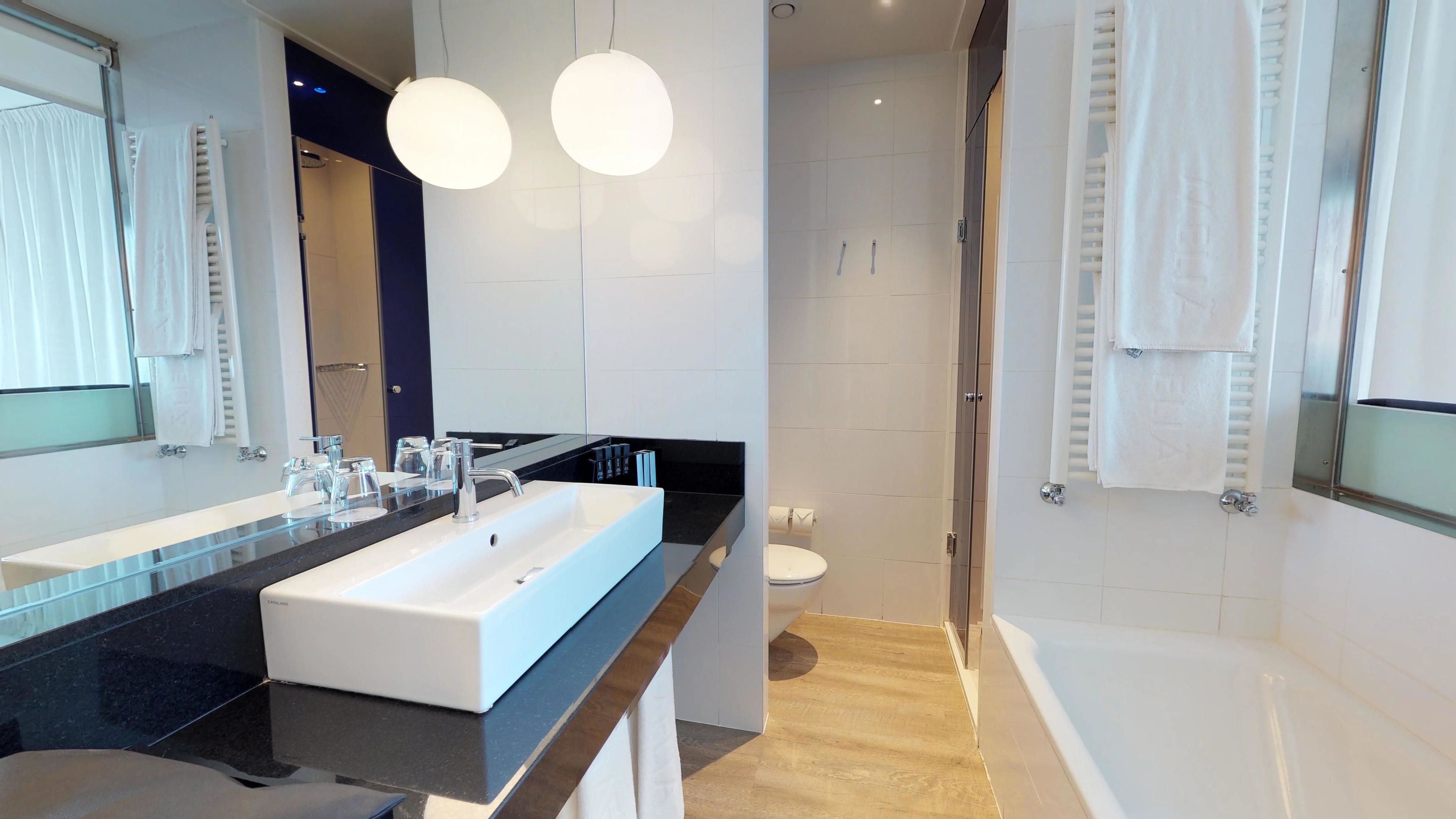 eco-friendly toiletries, hair dryer, towels