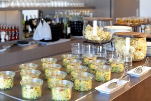 A buffet table with various food items and utensils. - Melia Barcelona Sky (Barcelona)