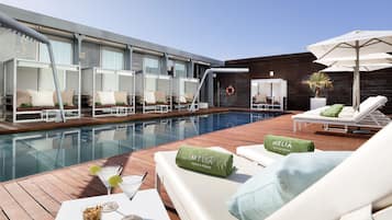 Seasonal outdoor pool, open 9 AM to 8 PM, pool umbrellas, pool loungers