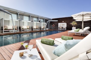 Seasonal outdoor pool, open 9 AM to 8 PM, pool umbrellas, sun loungers