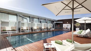 Seasonal outdoor pool, open 9 AM to 8 PM, pool umbrellas, pool loungers