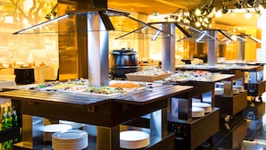 A buffet setup with multiple serving stations, each equipped with a large pot, a basket of bread, and a variety of dishes. - VIP Grand Lisboa Hotel & Spa (Lisbon)