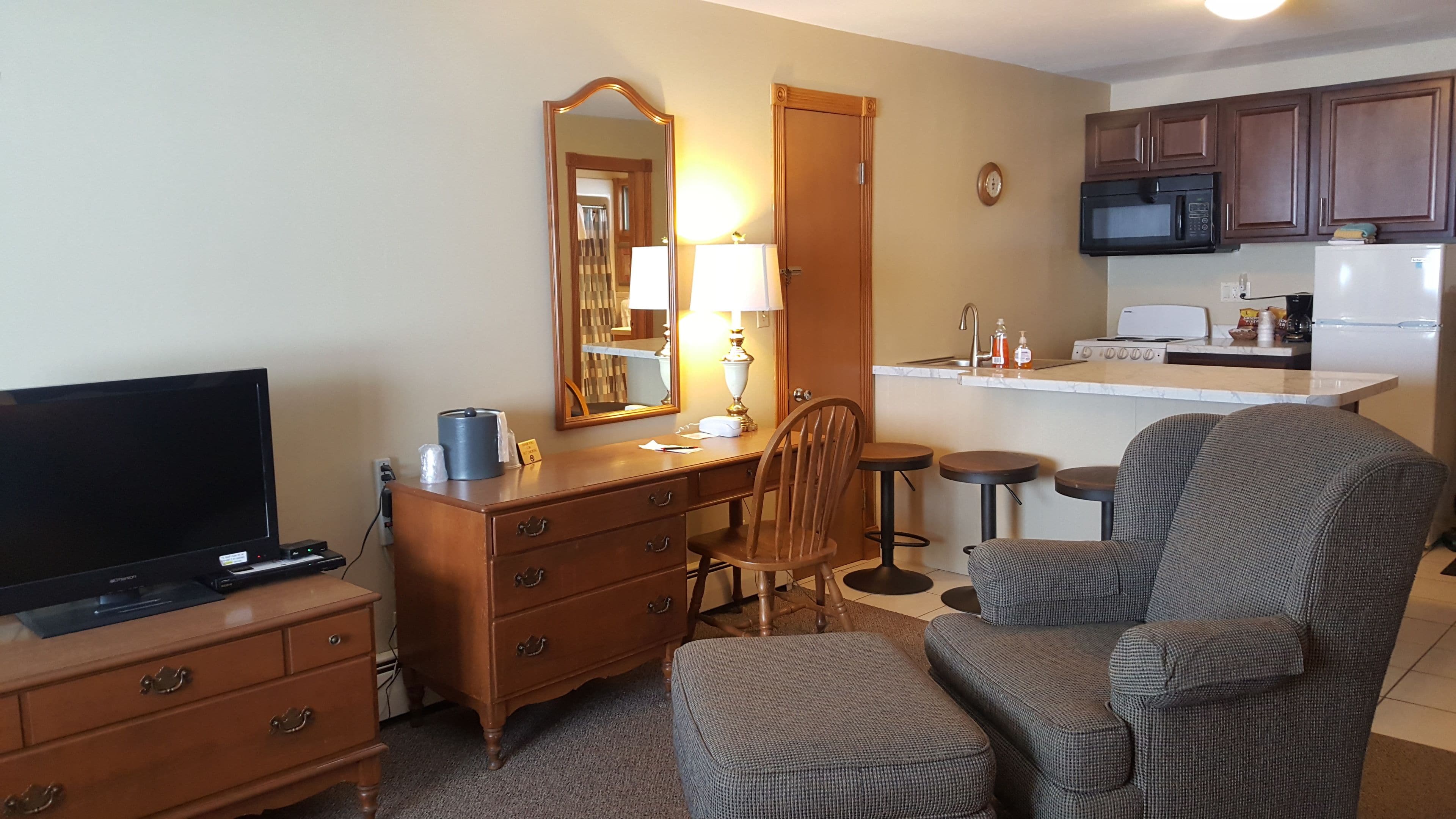 deluxe double room, multiple beds, kitchen, bay view | living area | tv