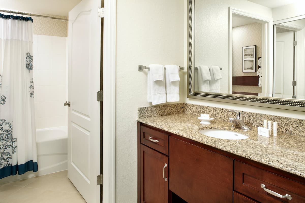 Suite, 2 Bedrooms, Smoking (Mobility/Hearing Accessible, Tub) | Bathroom | Combined shower/bathtub, designer toiletries, hair dryer, towels