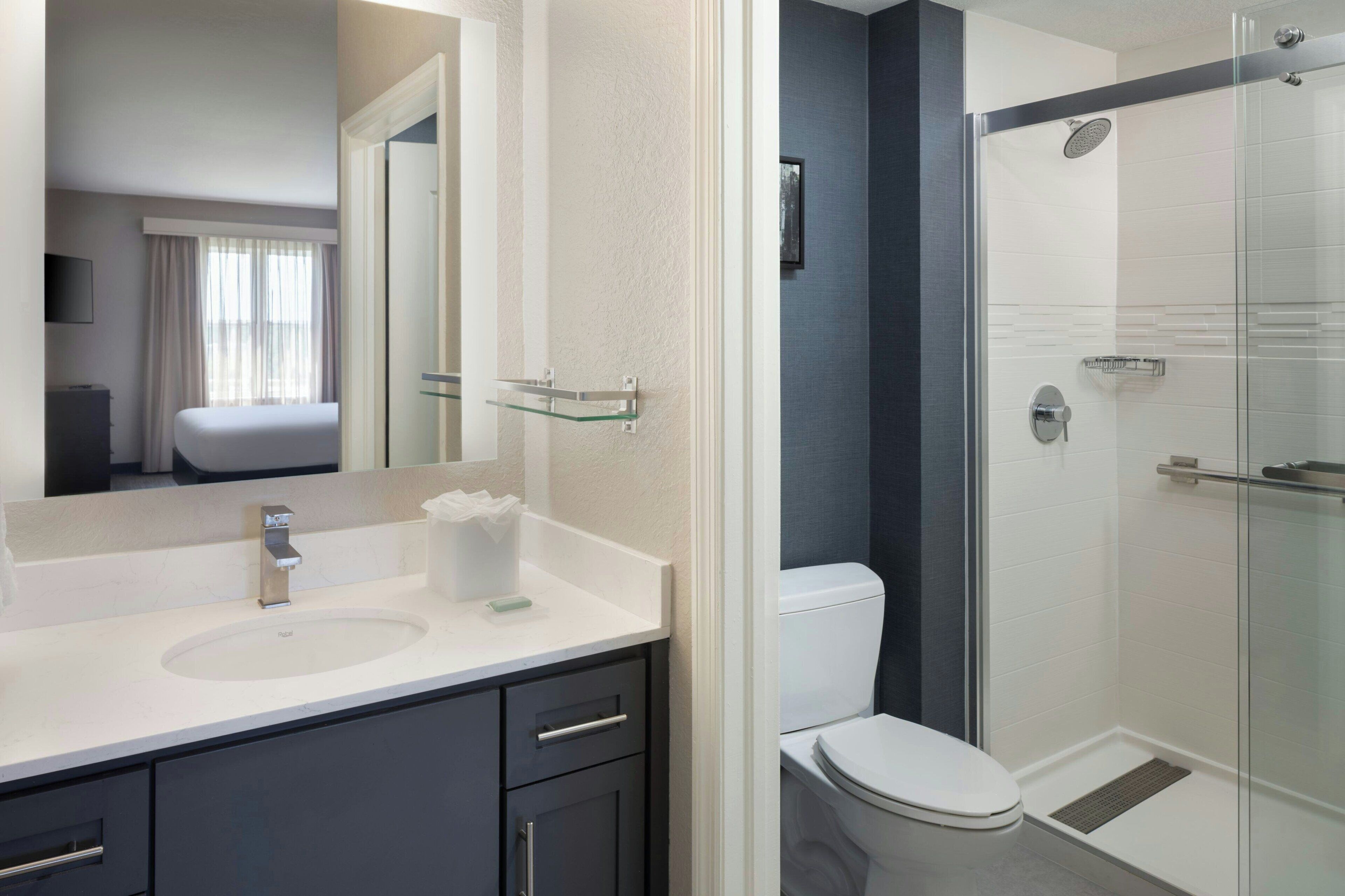 combined shower/bathtub, designer toiletries, hair dryer, towels