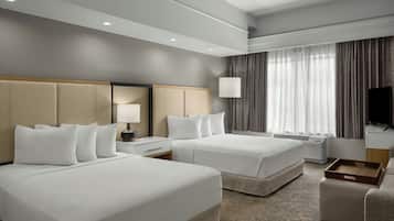 Premium bedding, desk, laptop workspace, blackout drapes
