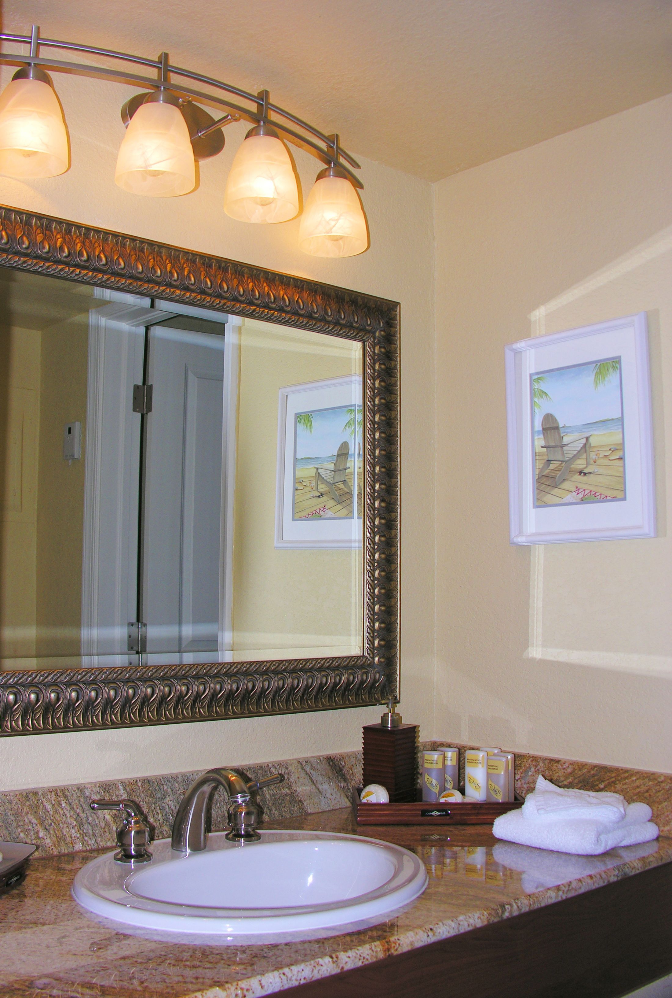 combined shower/bathtub, designer toiletries, hair dryer, towels