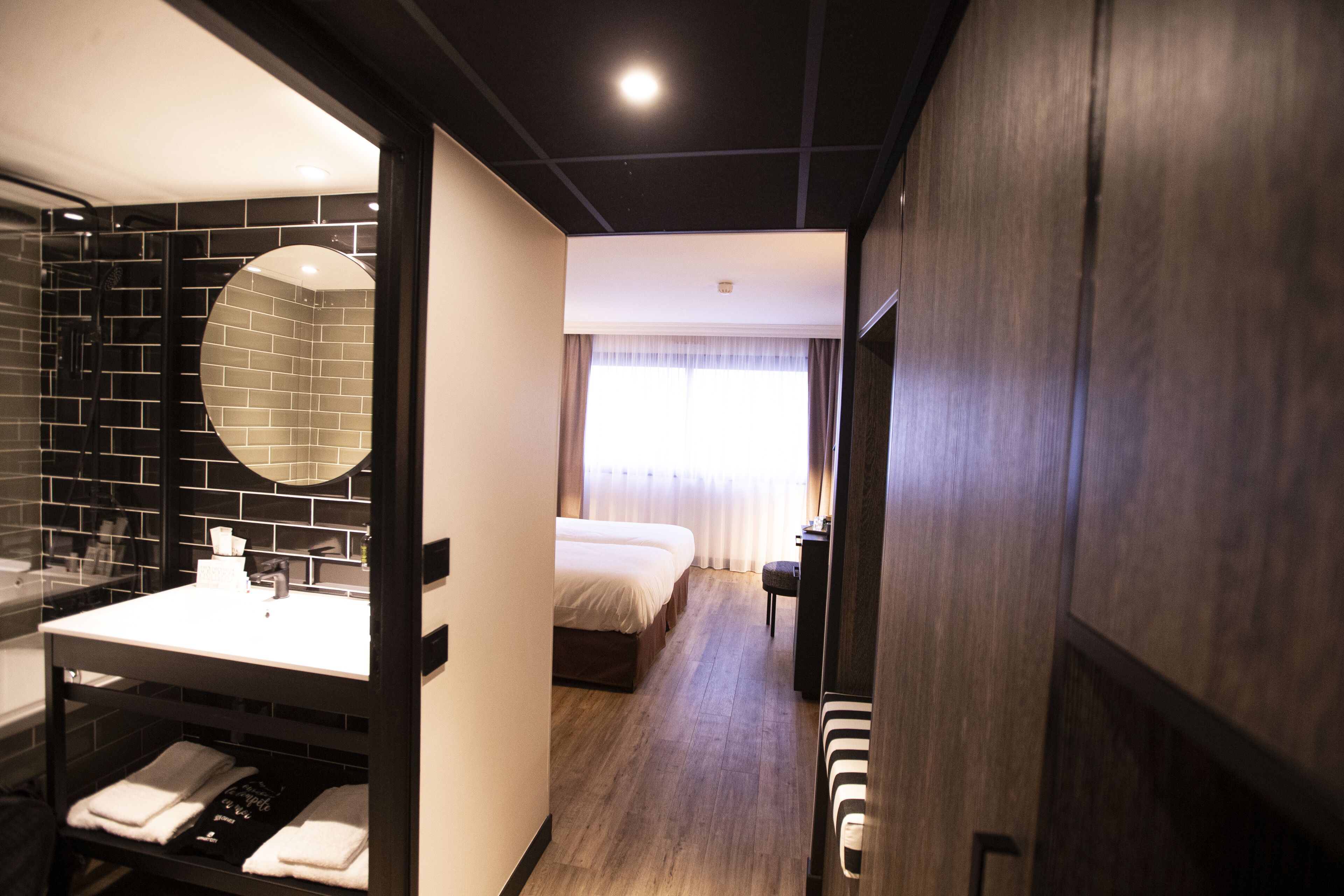 new generation twin room | in-room safe, desk, laptop workspace, blackout curtains