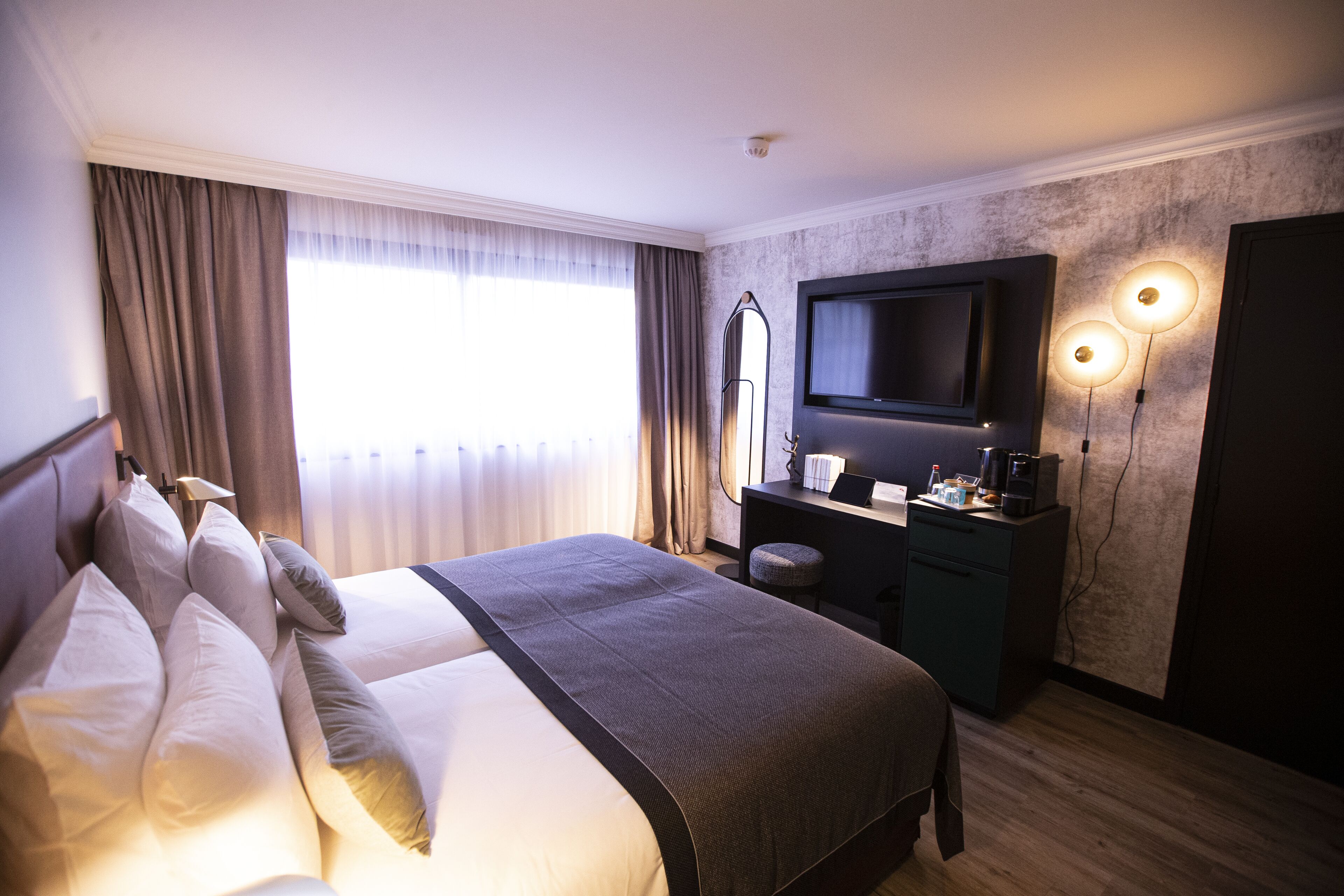 new generation twin room | in-room safe, desk, laptop workspace, blackout curtains