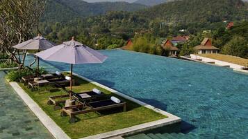 Outdoor pool, open 7:00 AM to 7:00 PM, pool umbrellas