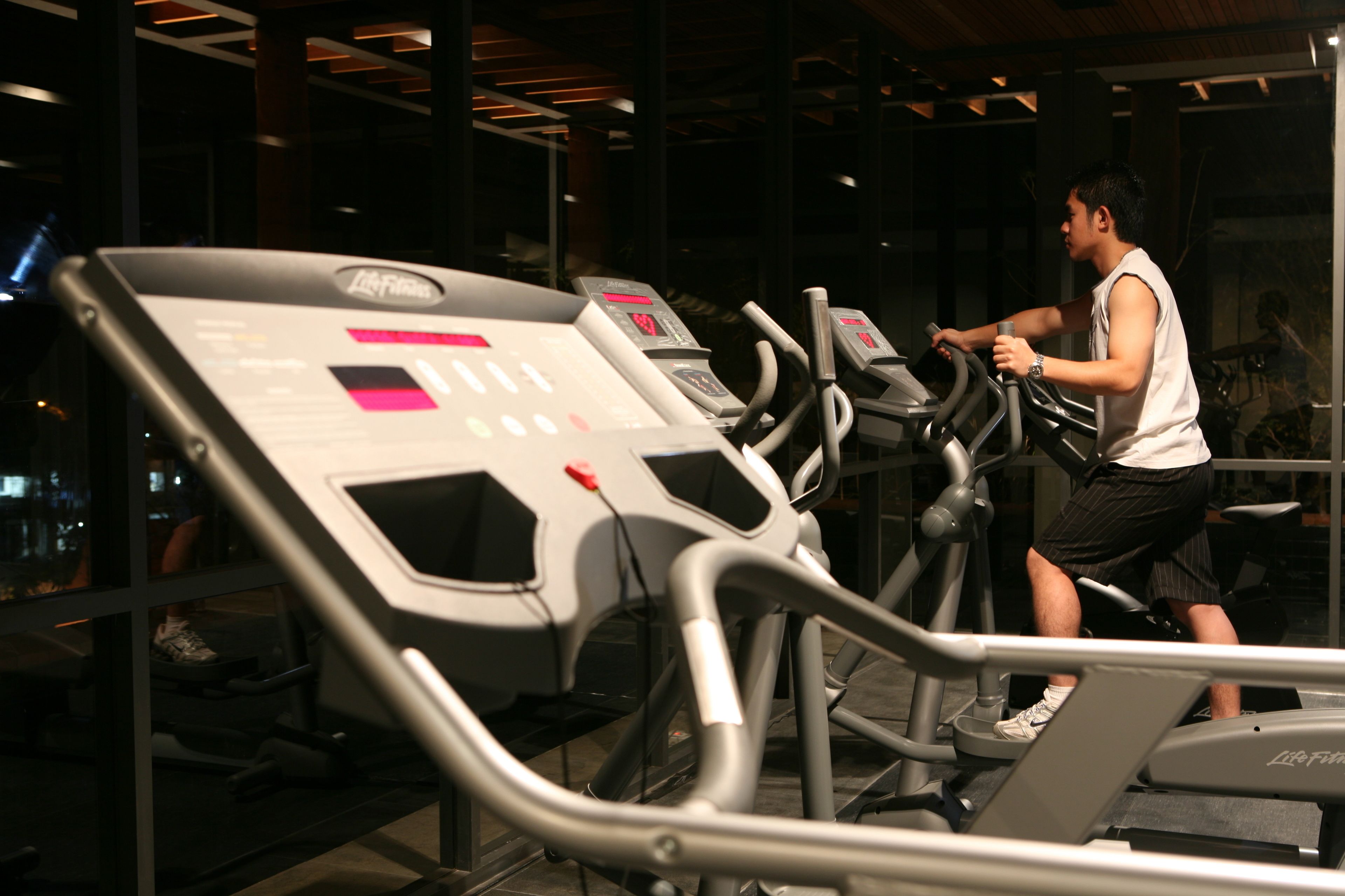 A gym with treadmills and exercise equipment.