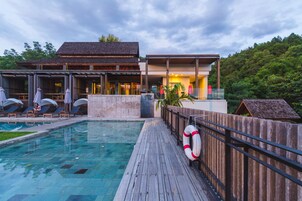 Outdoor pool, open 7:00 AM to 7:00 PM, pool umbrellas