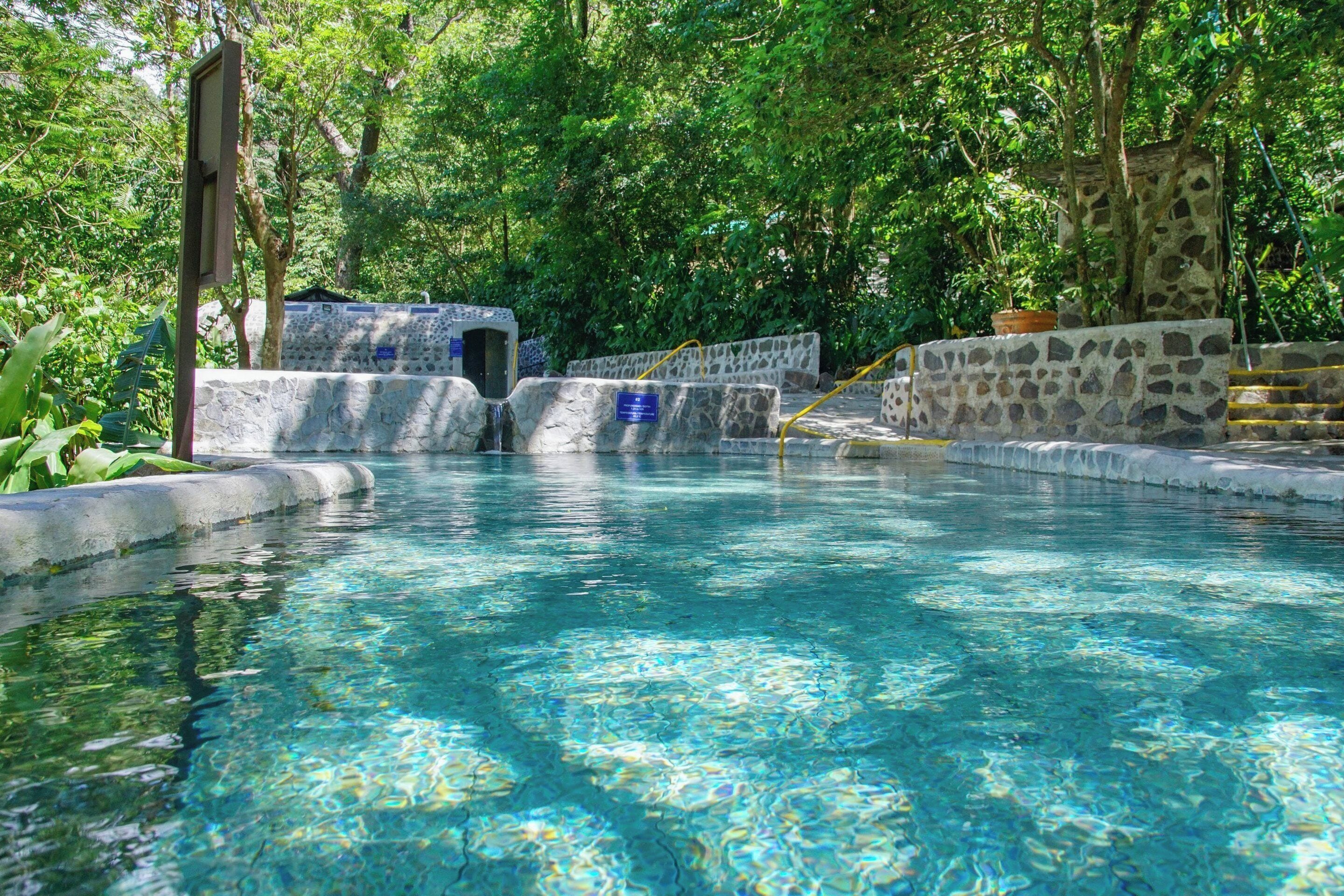 outdoor pool, open 7:00 am to 6:00 pm, pool loungers, lifeguards on site