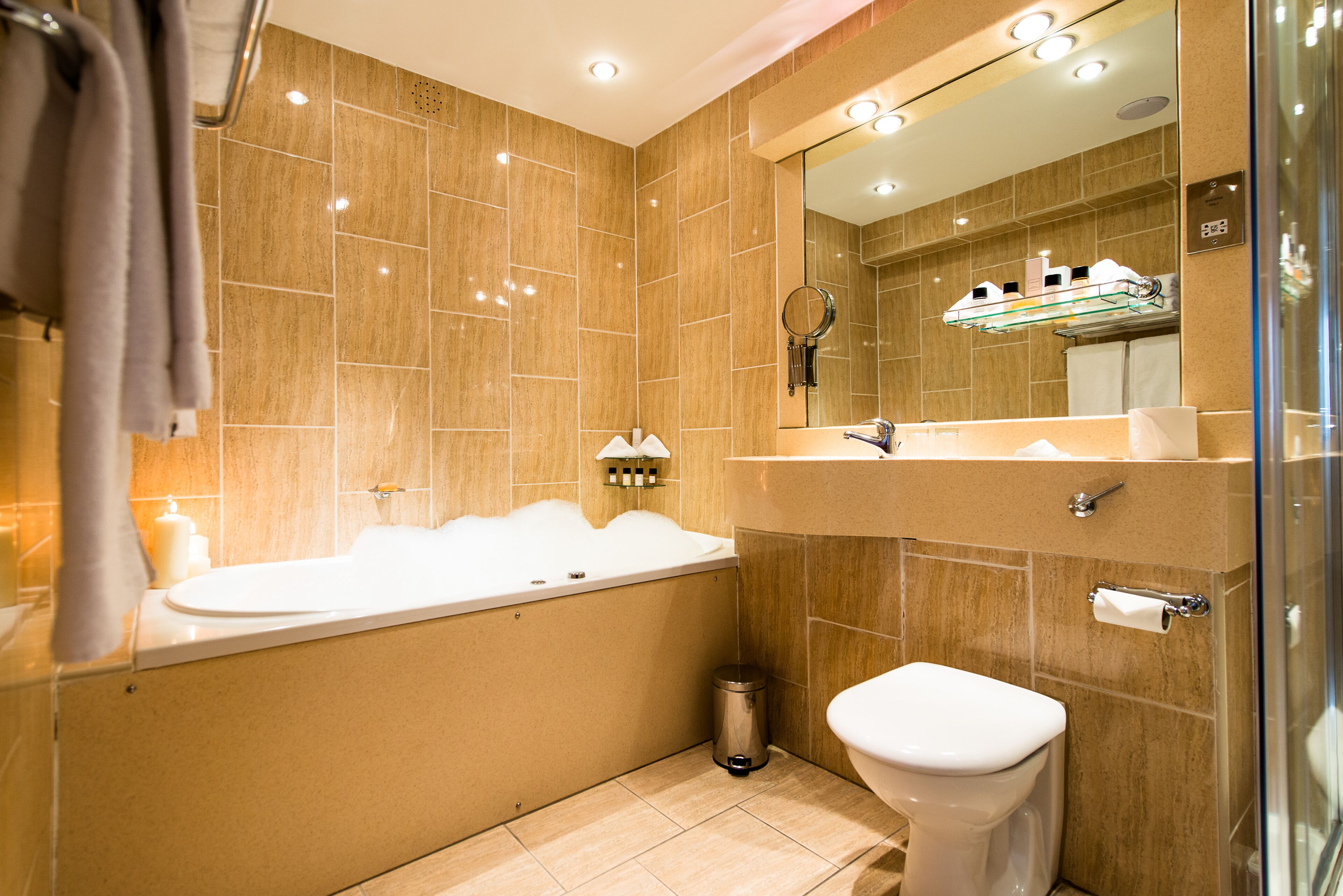 penthouse | bathroom | combined shower/bathtub, designer toiletries, hair dryer, towels