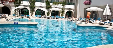 Seasonal outdoor pool, open 10:00 AM to 7:00 PM, pool umbrellas