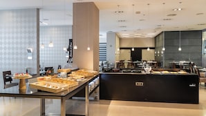 A modern breakfast buffet with a variety of pastries and baked goods. - Hotel Attica21 Coruña (A Coruña)