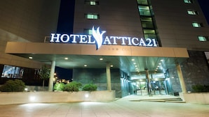 The exterior of Hotel Attica21 with a prominent entrance, a modern architectural design, and a well-lit facade. - Hotel Attica21 Coruña (A Coruña)