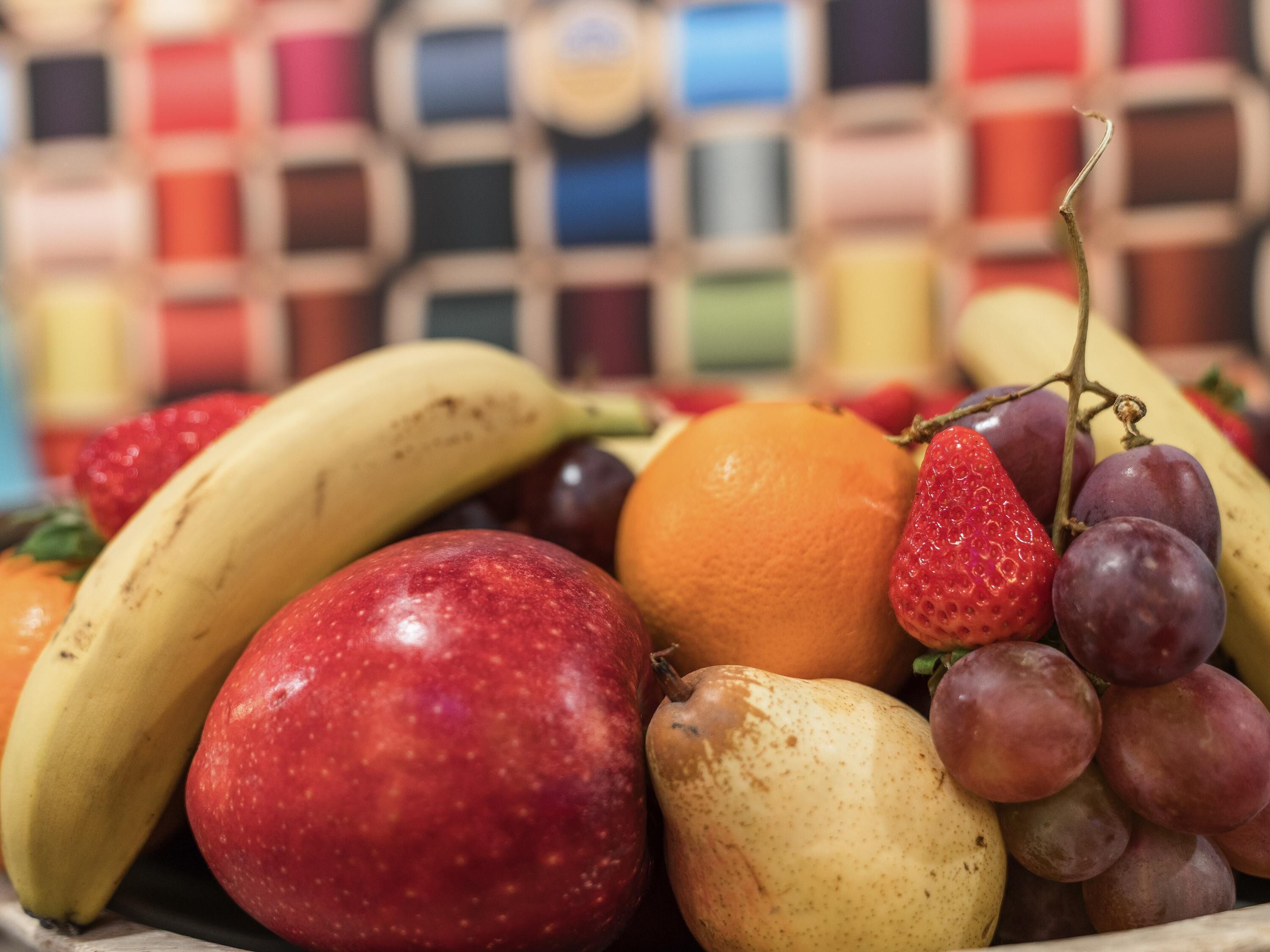 A variety of fruits including bananas, apples, oranges, and grapes.