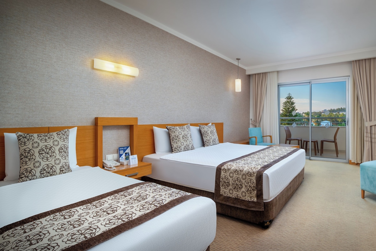 Standard Land View Room | Minibar, in-room safe, bed sheets