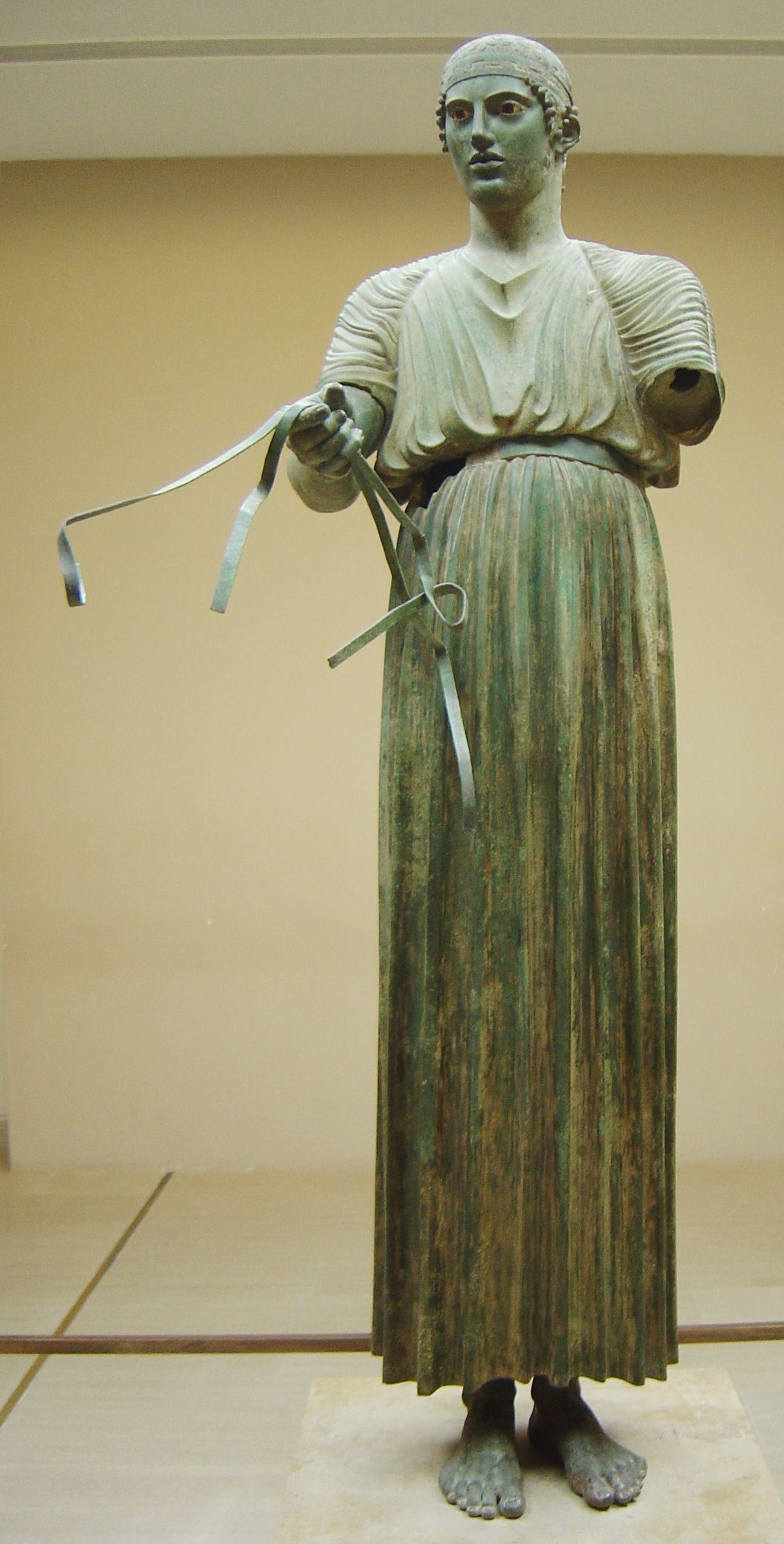 A statue in a museum setting.
