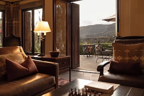 Presidential Suite (Casita) | Living area | Fireplace, iPod dock - Las Casitas, A Belmond Hotel, Colca Canyon (Yanque)