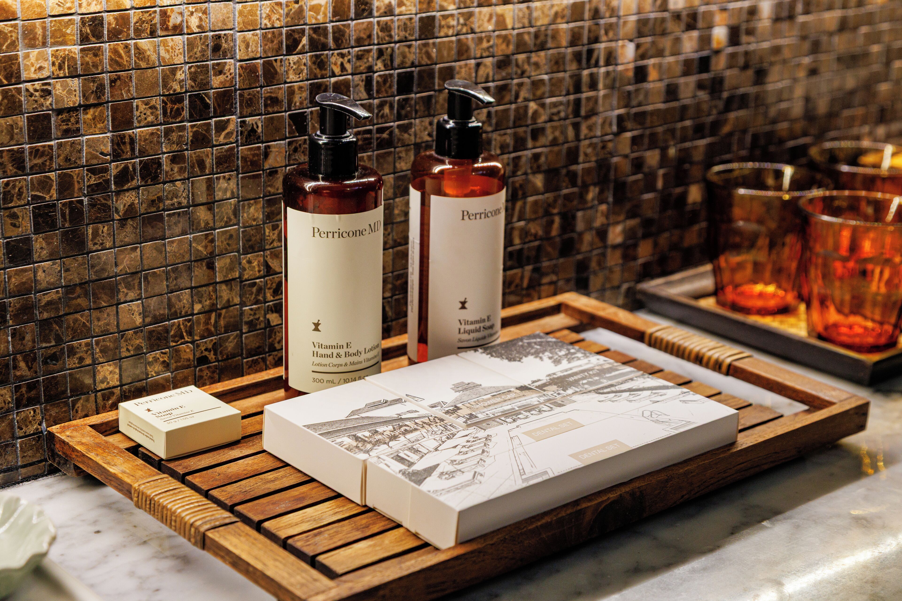 designer toiletries, hair dryer, slippers, towels