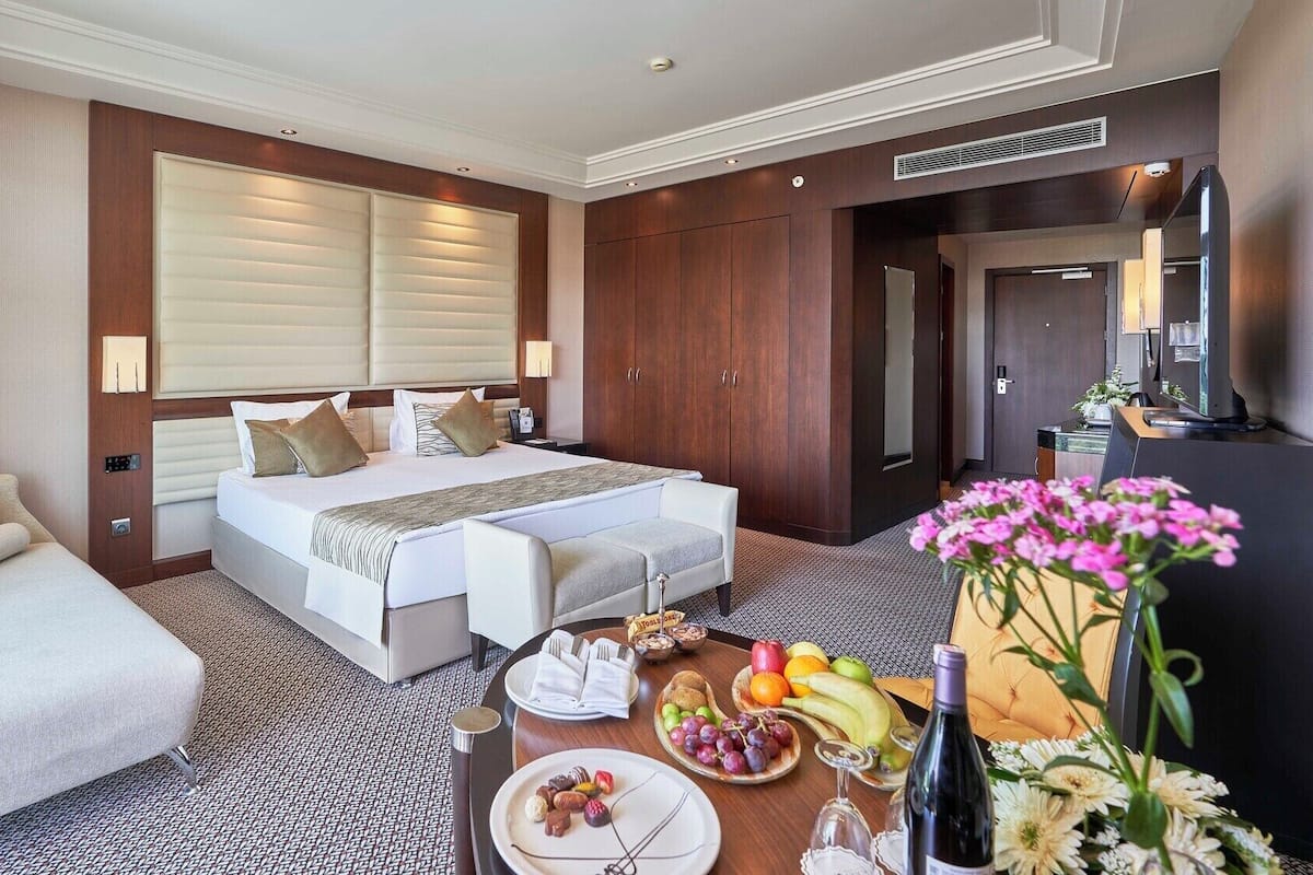 Frette Italian sheets, premium bedding, Tempur-Pedic beds, minibar